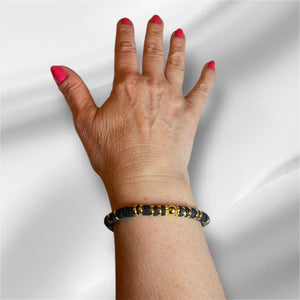 Bracelet perles plates Heishi noir et or