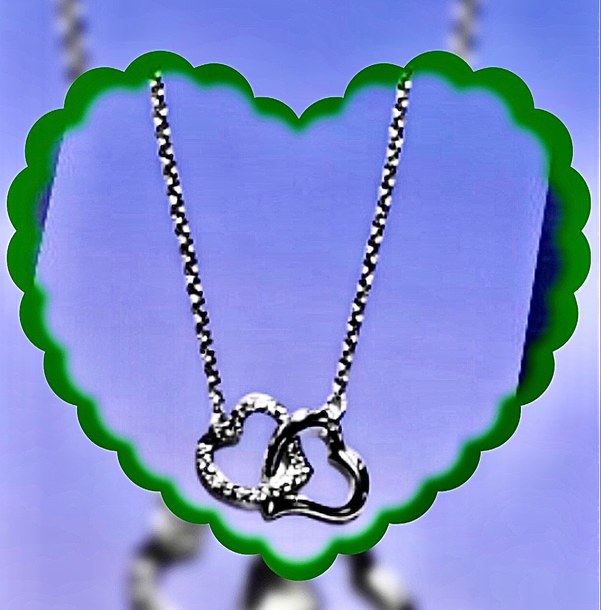 Pendentif plaqué or blanc « Coeurs enlacés « 